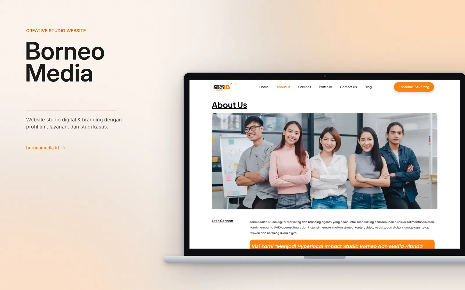 Laptop mockup of the About Us page with a team photo